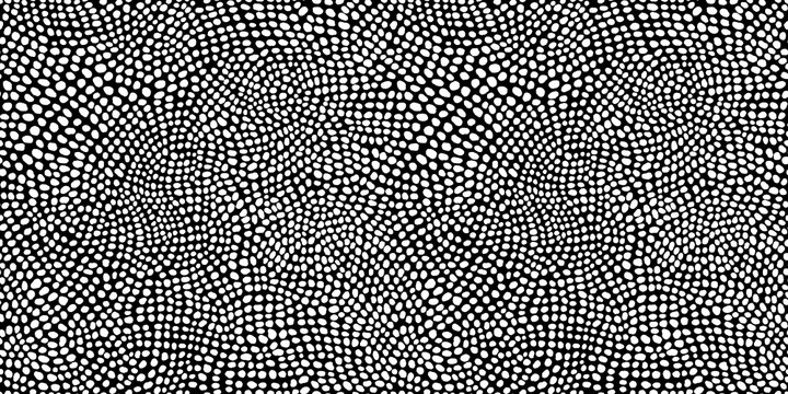 Seamless hand drawn small dense polkadot animal spots pattern in white on black background. Abstract aboriginal dot art motif or organic cellular texture in a trendy doodle line art or linocut style.