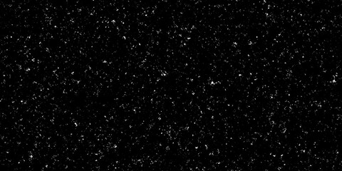 Seamless dark distressed dust, smudges, paint speckles and stains dirty urban grunge background texture. Grainy gritty white on black aged photo or vintage film effect noise pattern overlay.