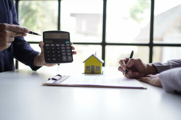 Businessman discussing commercial real estate sector faces risks as financial.