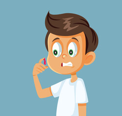 Scared Little Boy Checking His Bloody Injury Vector Cartoon Illustration. Squeamish child about to faint when seeing blood
