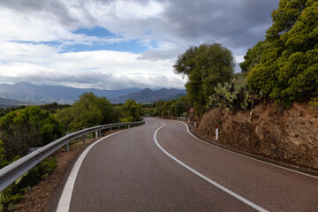 Scenic Highway, Orientale Sarda, in the mountain landscape. Cloudy Rainy Day. Sardinia, Italy.
