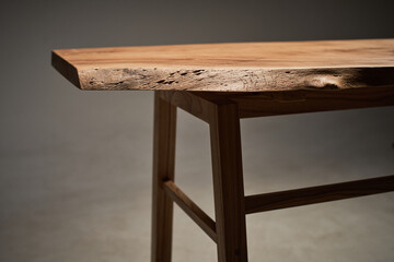 Wooden table with curved natural edge