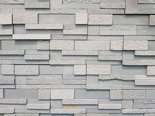 White marble wall cut small slices stacked, into the background.
With copy space.