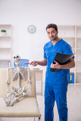 Young male doctor radiologist and skeleton patient at the hospit