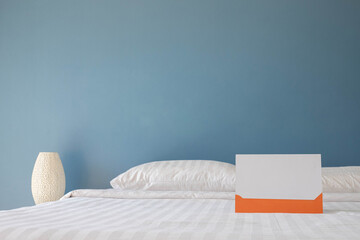 white bed with blue walll