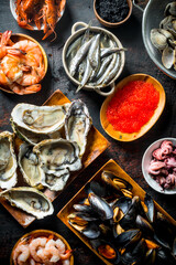 Fresh seafood on various plates.