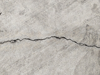 Road surfaces from cracked cement or damaged by earthquakes or prolonged use.