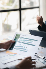 Group business people are having a meeting and planning their business together in the conference room, leaders of startup companies share their opinions and discuss how to run a successful business.