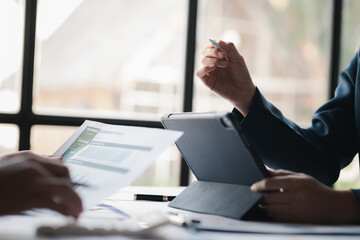 Group business people are having a meeting and planning their business together in the conference room, leaders of startup companies share their opinions and discuss how to run a successful business.