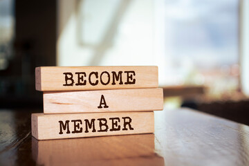 Wooden blocks with words 'BECOME A MEMBER'.