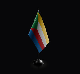 Small national flag of the Comoros on a black background