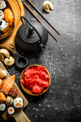 An assortment of different types of sushi and rolls.