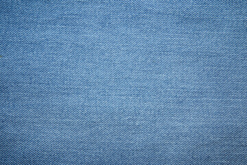 Blue jeans fabric background texture. Blue jeans fabric cloth textile material.