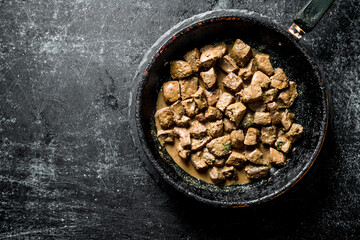 Pieces of fried liver.