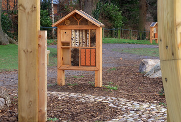 A bug house in a woodland play area