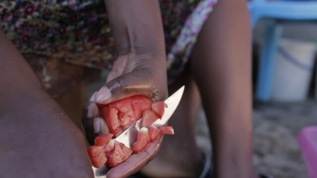 Close up of Hands cutting tomatoes