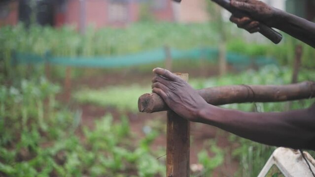 African Hands with Hammer