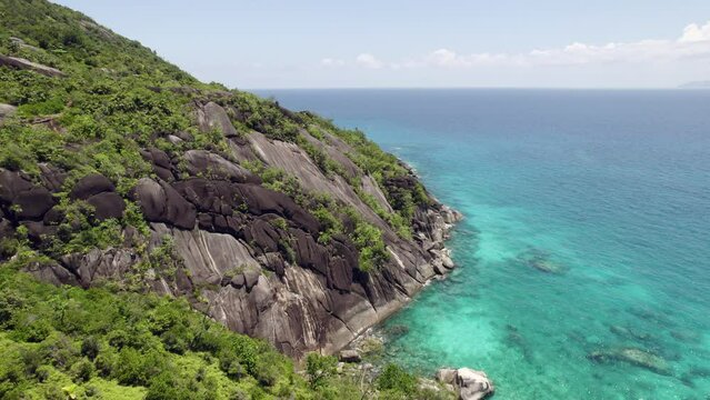 Drone over national park, anse major nature trail, and marine park, rock boulders blue turquoise water