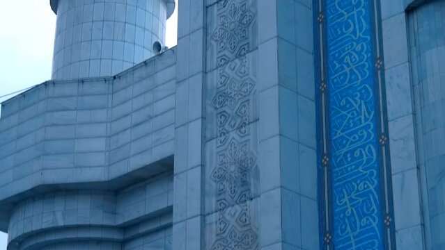 The functioning central mosque in the city of Almaty, built in the Muslim style, fascinates with its beautiful view. Amazing golden domes. Shot in motion 