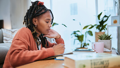 Studying, student and black woman writing in notebook for education, learning and notes for academic class. University, college and girl focus, busy and thinking for homework, assignment and project