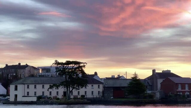 Winter sky and sunrise over Kinsale, Ireland with slow movement upward.