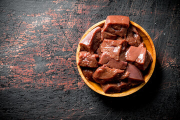 Pieces of fresh liver in the bowl.
