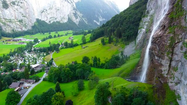Lauterbrunnen townscape and waterfall drone aerial view above swiss mountains in alps.Tourist destination. Travel Europe.