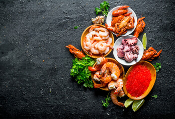 Red caviar with seafood, parsley and lime slices.