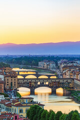 Arno river in Florence with Ponte vecchio bridge