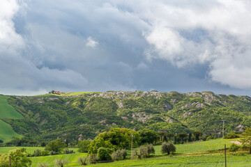 Beautiful Tuscan landscape view with storm clouds in the sky