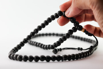 Tasbih is a means or infrastructure for dhikr. is exalted memory. remember god. prayer beads breeding activities. on a white background.