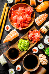 Assortment of different types of sushi, rolls and maki.