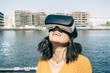 Woman using VR goggles, Berlin, Germany