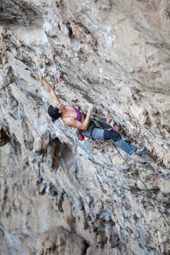 Girl rock climbing at El Chanchuyo (Chonta) cave near Taxco, Guerrero, Mexico.