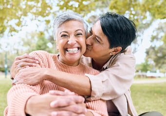 Couple of friends, portrait or cheek kiss in nature park, grass garden or relax environment in support, love or retirement. Smile, happy or senior women in elderly bonding, fun embrace or trust hug