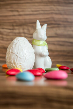 Close-up of an Easter egg with Easter bunny and candies