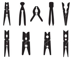 Black silhouettes of different clothespins on a white background - 562936873