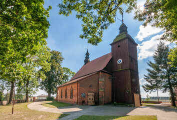 Fototapeta na wymiar Church of the Assumption of the Blessed Virgin Mary in Lubnice, Lodz Voivodeship, Poland