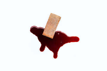 Brick with blood on white background.