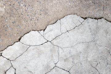 Cracked cement or concrete surface texture for background.