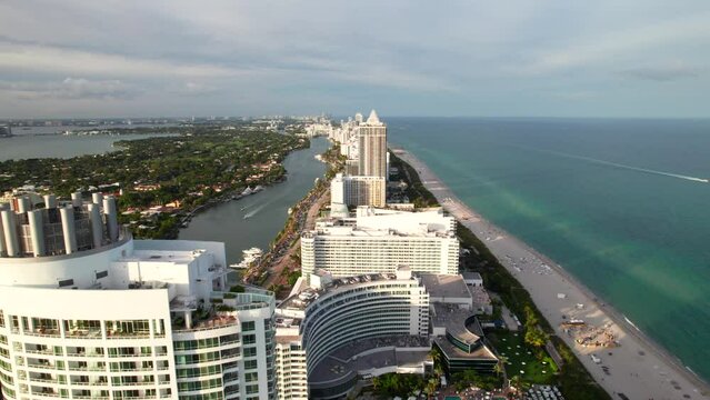 Slow drone dolly shot of Miami Beach, Florida. Fontainebleau hotel and other classic art deco hotels and resorts.