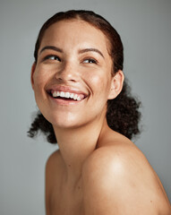 Skincare, beauty and face of woman in studio isolated on a gray background. Makeup cosmetics,...