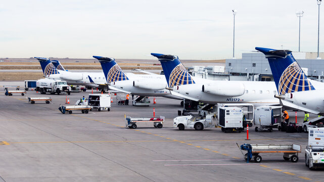 Denver, USA - February 6, 2015: Airplanes boarding at airport terminal