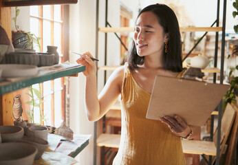 Pottery stock check, business woman and clipboard data of a entrepreneur with store information. Happy, counting and startup worker busy working on a ceramic inventory search for accounting audit