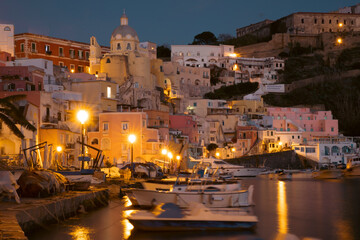 Fototapeta na wymiar Beautiful fishing village at night, Marina Corricella on Procida Island, Italy.