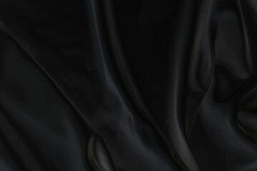 Obraz premium Smooth elegant black silk fabric or satin luxury cloth texture for abstract background