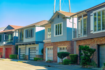Row of modern houses in the historic districts of downtown san francisco california with sutro tower visible in sky