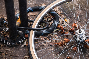 Locked bicycle wheel at bike parking - bike stolen