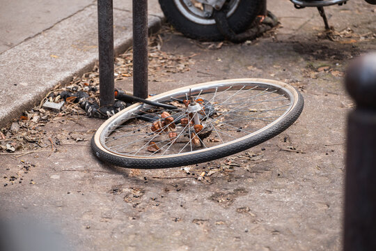 Locked bicycle wheel at bike parking - bike stolen