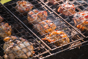 Fried chicken on a grill in a golden crispy crust